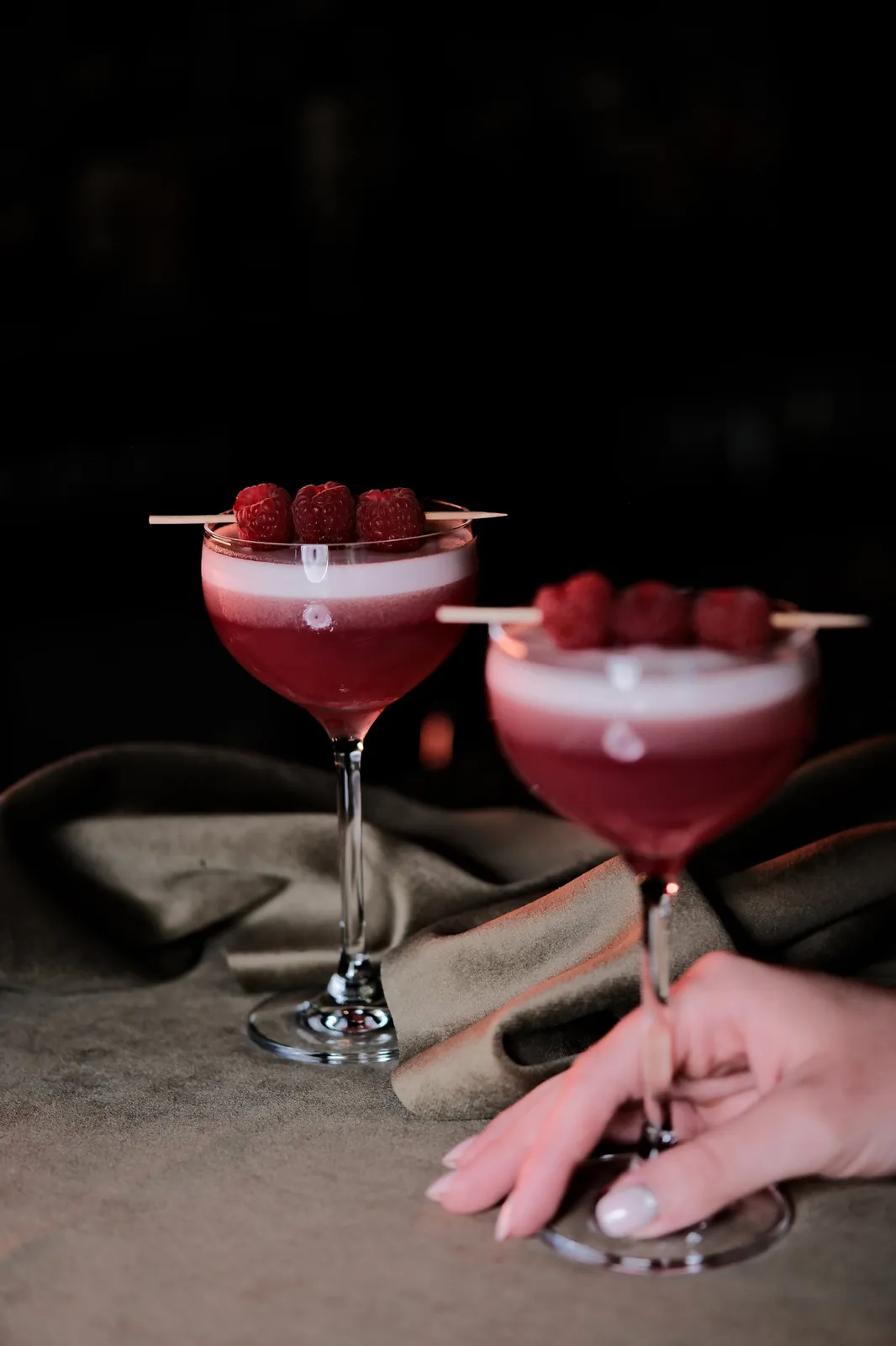 Two Scarlet Siren signature cocktails with raspberries at Sippers cocktail bar in Bucharest